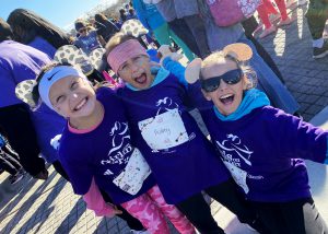 A picture of three Girls on the Run members making faces