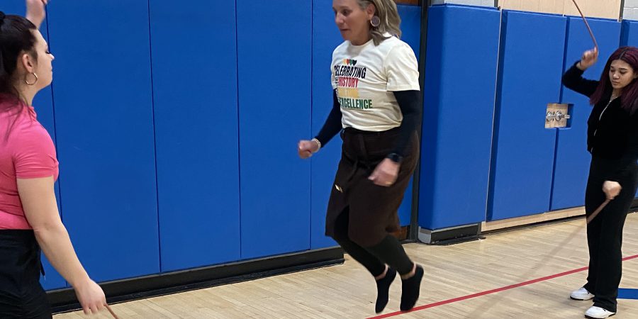 Principal jumps ropes with students