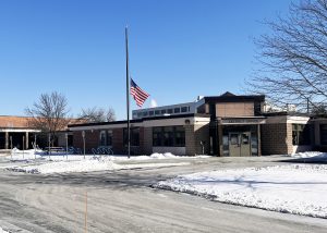 Front of school. Flag at half mast