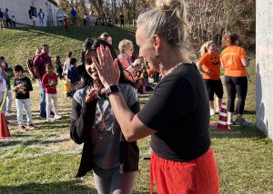 Runner gets a high five from Principal Wylie