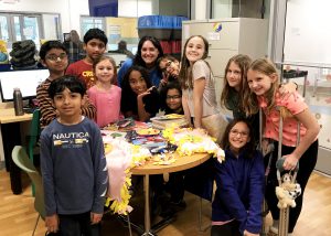 Students pose at the sheler