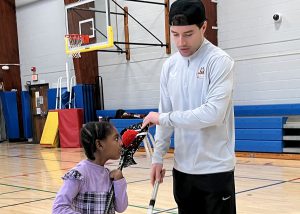 Player instructs a student